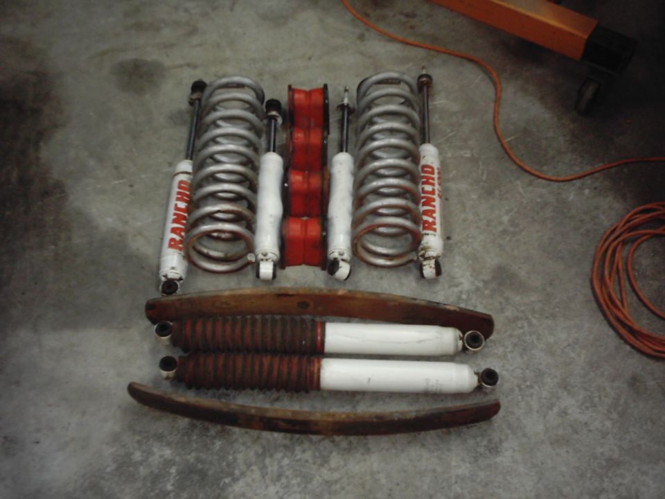Rancho shocks and coil springs with red polyurethane bushings