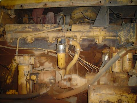 1966 International School Bus - Engine components, including oil filters and fuel lines, are visible in this close-up view.