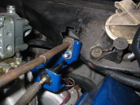 1985 Ford Crown Victoria LTD - Engine bay components including a blue bracket and carburetor are visible in this close-up shot.