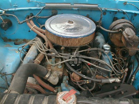 1986 Ford Bronco - Engine bay view of a Ford V8, likely from the 1980s, with an aftermarket air cleaner.
