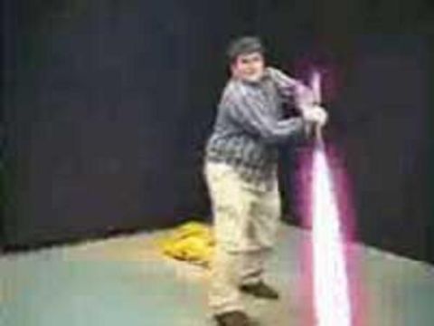 1991 Ford Bronco - A person holds a toy lightsaber, posing for a photo.