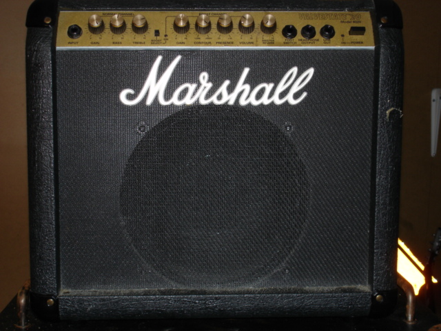 Black Marshall guitar combo amplifier with gold control panel