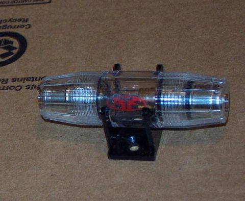 1985 Ford LTD Crown Victoria - An in-line fuse holder is shown against a cardboard background.