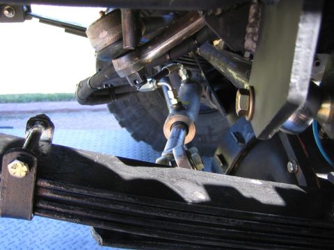 1994 Ford Bronco - Undercarriage view of steering and suspension parts, with a website URL visible.