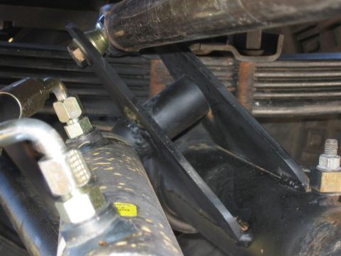 1994 Ford Bronco - Detail of a hydraulic ram assist component, likely part of a steering or suspension system.