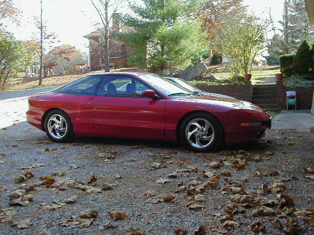 Red 1994 Ford Probe 3q-front view