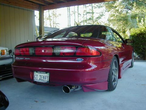 1994 Ford Probe - This 1994 Ford Probe features a custom exhaust and a vanity plate reading 'GT 2ENVY'.