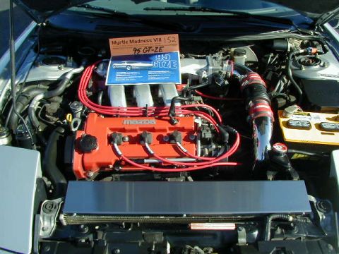 1994 Ford Probe - The engine bay displays a '95 GT-ZE badge, contradicting the registry's claim of a 1994 Ford Probe.