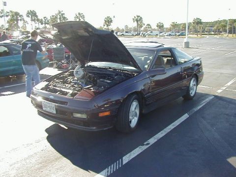 1994 Ford Probe - A modified 1993 Ford Probe is displayed with its hood up, revealing a turbocharger under the engine bay.