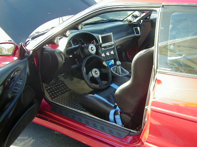 1994 Ford Probe interior with racing seats and aftermarket steering wheel