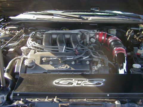 1994 Ford Probe - Engine bay view of a Ford vehicle, an aftermarket intake system and 'GTS' branding.
