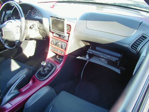 1994 Ford Probe - Interior view of a 1994 Ford Probe, a custom stereo and CD player in the glove box.
