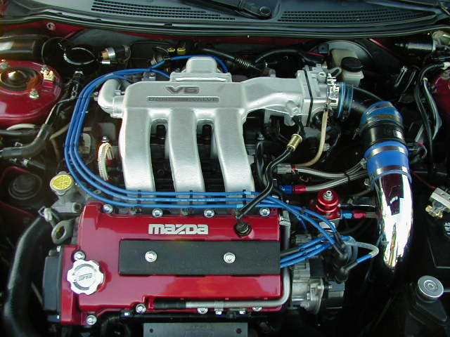 Mazda V6 engine with red valve covers and silver intake manifold