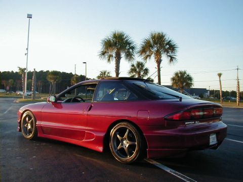 1994 Ford Probe - This 1994 Ford Probe is captured in a rear three-quarter view, its distinctive coupe body style under a clear sky.
