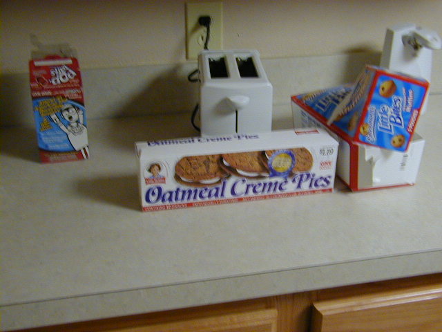 Oatmeal Creme Pies, Little Bites snacks, and a toaster on a kitchen counter