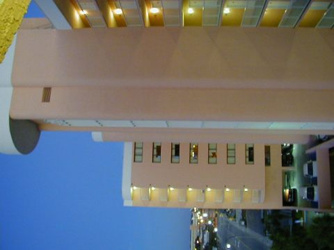 1994 Ford Probe - A building facade with multiple windows and exterior lighting is visible against a blue sky.