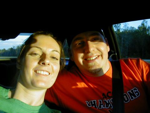 1994 Ford Probe - A couple smiles for a selfie while riding in a car.