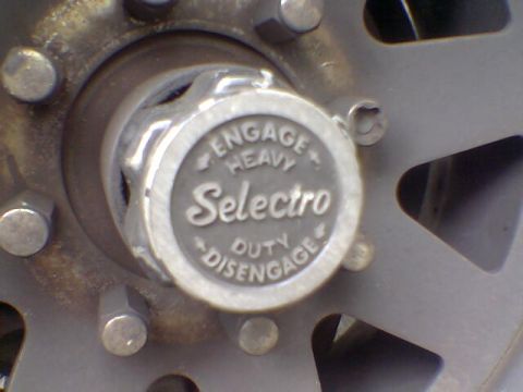 1988 Ford Bronco - This close-up shows a hubcap with "Selectro" and "Engage Heavy Duty Disengage" text.