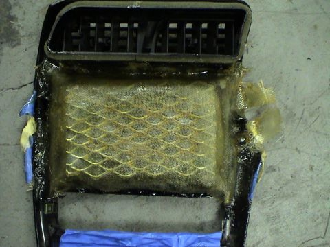 1997 Ford Probe - Modified center console part with vent and mesh filter, showing custom fiberglass work.