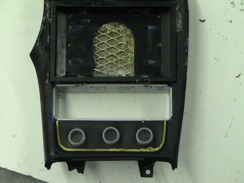 1997 Ford Probe - Center console trim piece with openings for radio and controls.