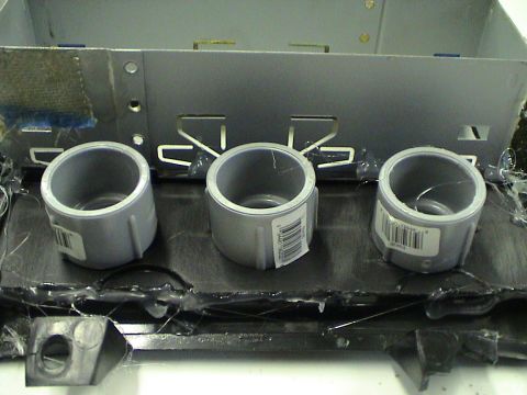 1997 Ford Probe - Close-up of a custom center console modification with three pipe fittings and a metal bracket.