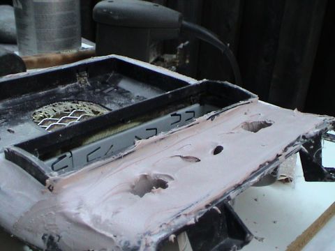 1997 Ford Probe - Custom center console modification with body filler applied and holes cut.