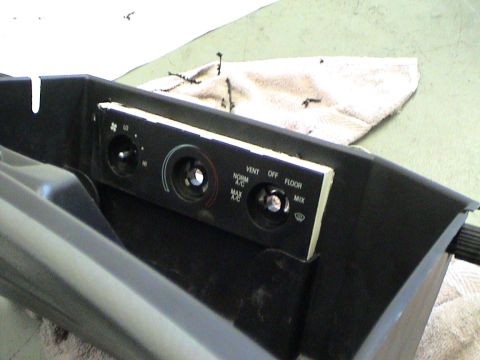1997 Ford Probe - Close-up of car interior climate controls, showing knobs for fan speed, temperature, and air direction settings.