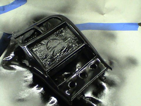 1997 Ford Probe - A black center console part is being worked on, possibly painted or refinished.