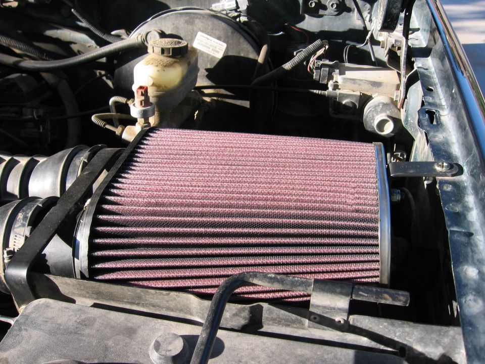 Open-element red cone air filter installed in a Ford Bronco engine bay near the brake master cylinder