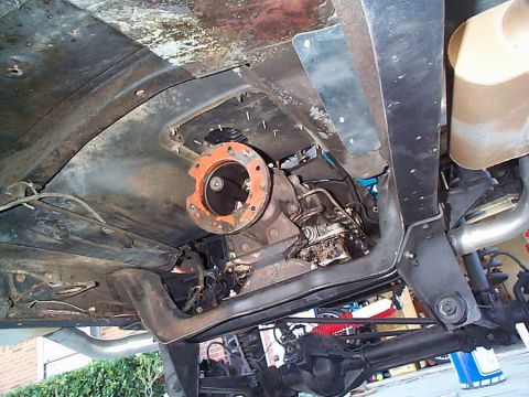 1979 Ford Bronco - Undercarriage view of a vehicle's transmission and exhaust components.