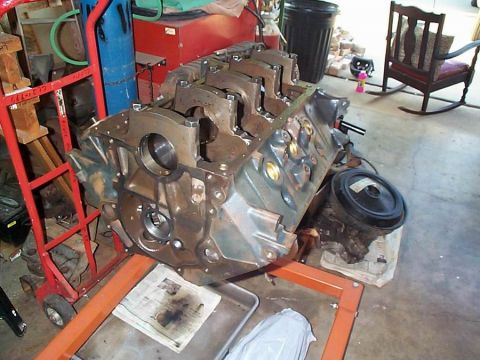1979 Ford Bronco - Engine block being worked on in a garage setting.