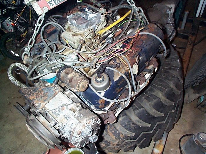 Engine and large tire assembly, viewed from above