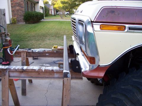 1979 Ford Bronco - Front end of a 1979 Ford Bronco, showing the grille and bumper area.