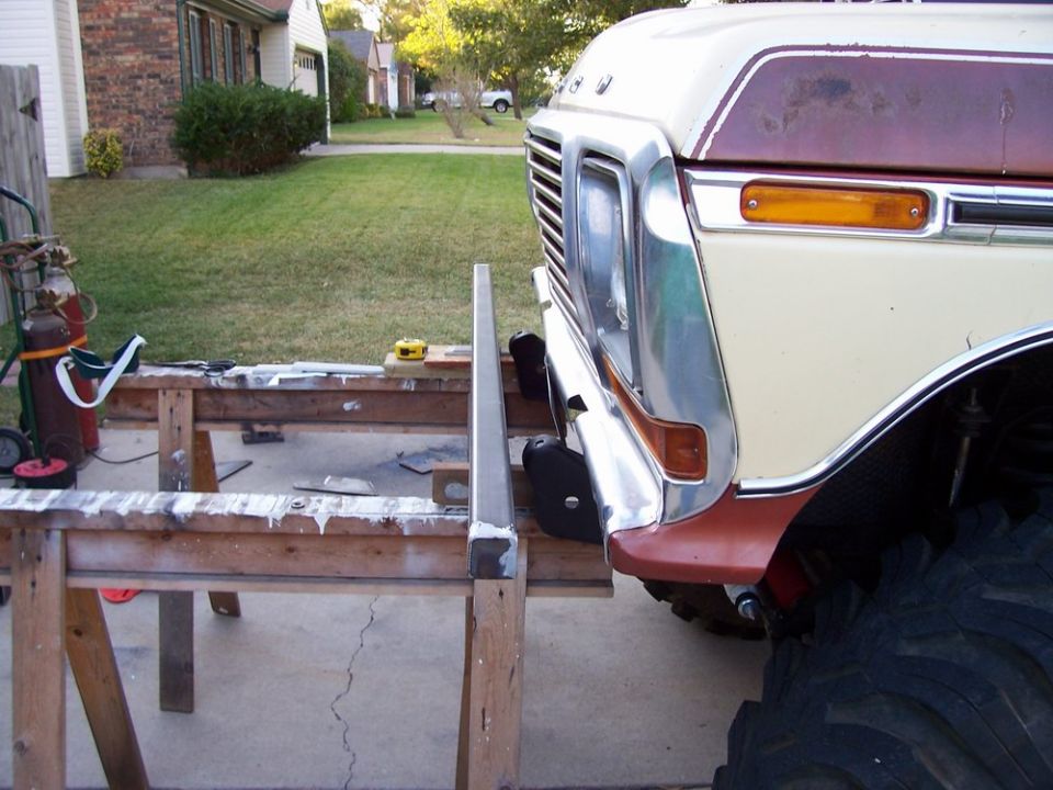 1979 Ford Bronco front clip with chrome grille and bumper, parked outside