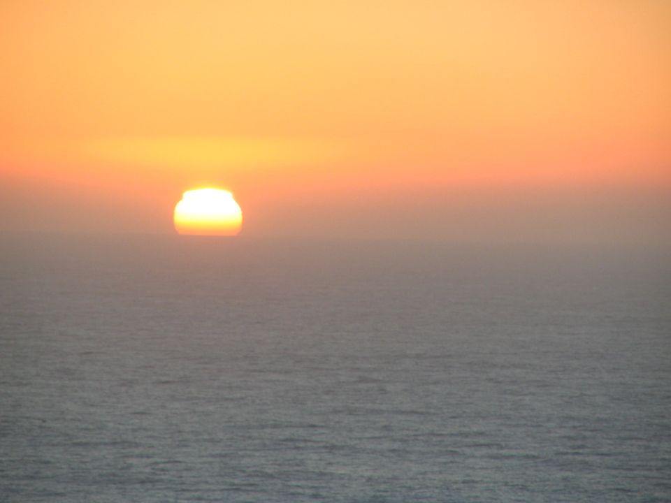 Sunset over the ocean with a watermark