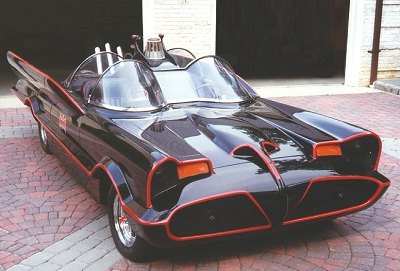 1991 Ford Bronco - The iconic Batmobile, a custom-built vehicle, is shown from a 3/4 front view.
