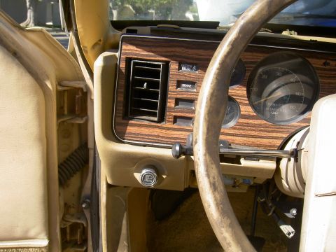 1982 Ford Mustang - Dashboard of a 1982 Ford Mustang, wood grain trim and instrumentation.