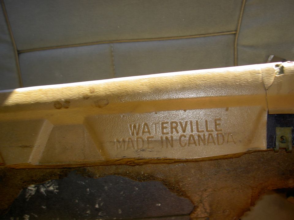 Tan interior car part with embossed text 'WATERVILLE MADE IN CANADA'