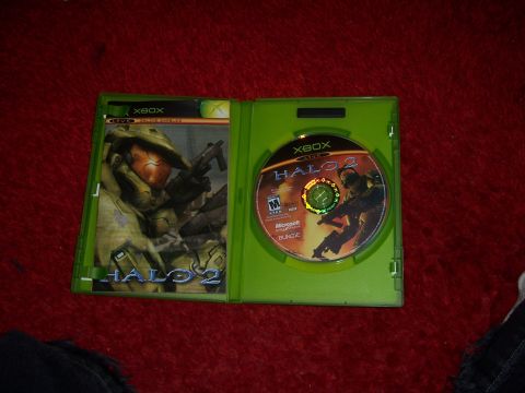 1997 Ford Probe - Open Xbox game case for Halo 2, displaying the game disc and cover art.
