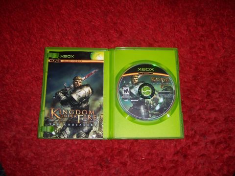 1997 Ford Probe - The Xbox game Kingdom Under Fire: The Crusaders is shown in its case with the disc.