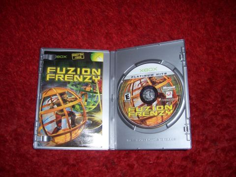 1997 Ford Probe - The Fuzion Frenzy game case and disc are displayed open on a red background.