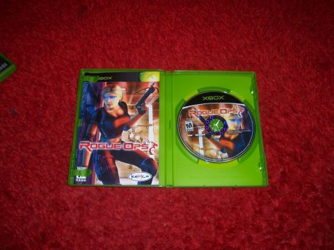1997 Ford Probe - Open Xbox game case for Rogue Ops, the disc and cover art.