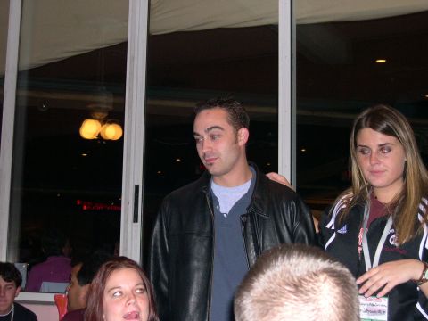 1997 Ford Probe - A group of people are seen indoors, with some individuals looking towards the camera.