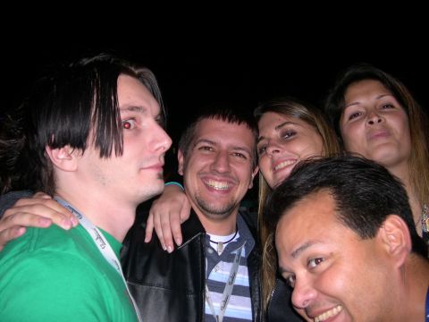 1997 Ford Probe - A group of friends takes a selfie together at an event.
