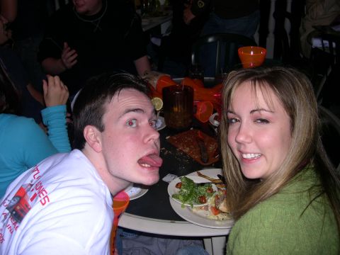 1997 Ford Probe - A group of people are gathered around a table laden with food and drinks.