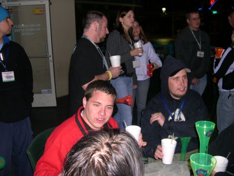 1997 Ford Probe - A group of individuals are seen socializing around a table, holding cups and appearing to be at an event.