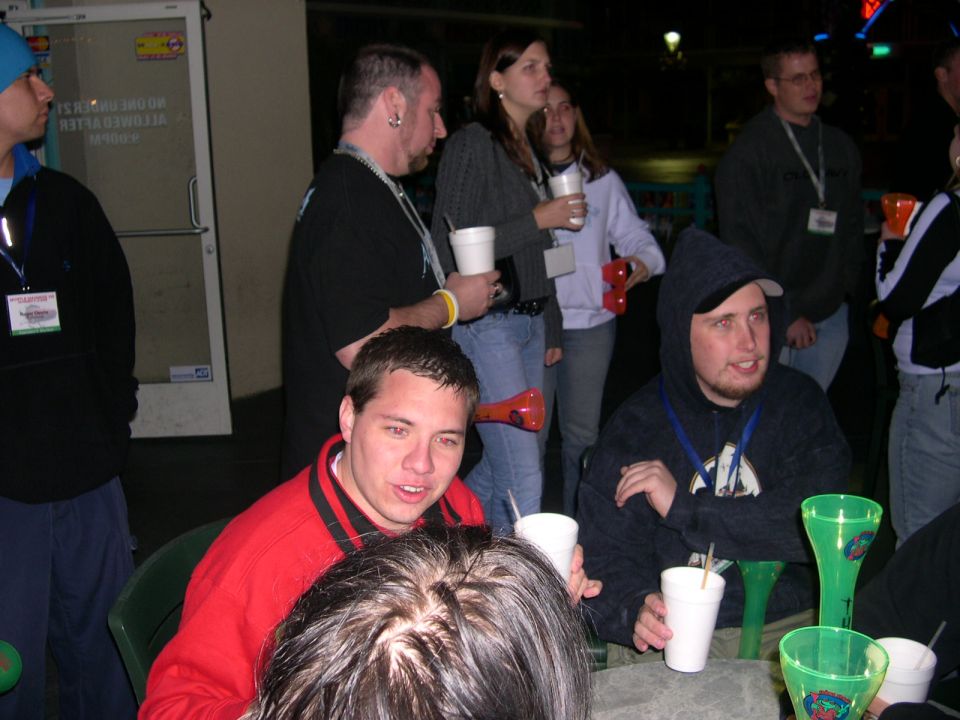 People gathered around a table with drinks