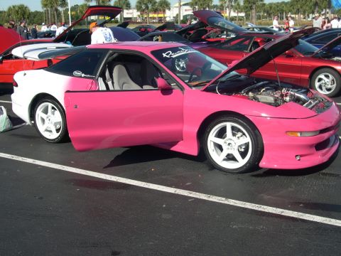 1997 Ford Probe - A customized Ford Probe is displayed at an outdoor event with its doors and hood open.