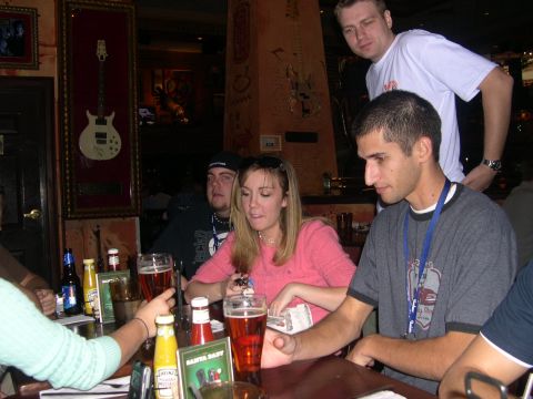 1997 Ford Probe - A group of friends enjoys drinks and conversation at a table in a restaurant.
