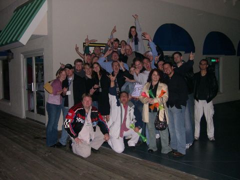 1997 Ford Probe - A large group of people gathered together for a photograph, some making celebratory gestures.